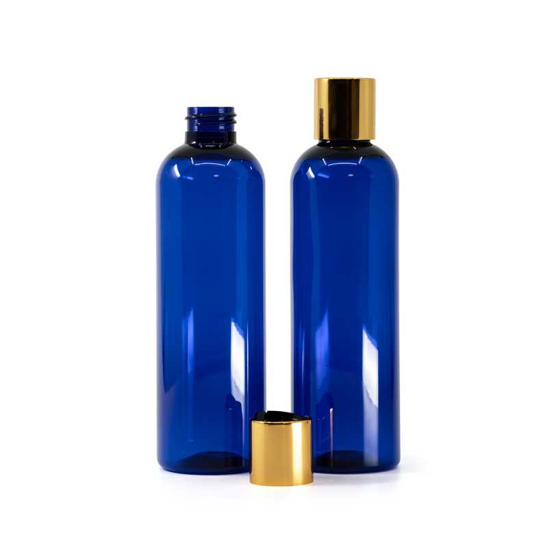 Botella de plástico azul, tapón disc-top dorado con centro negro, 250 ml