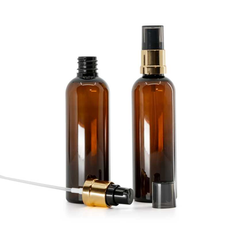 Frasco de plástico marrón, bomba negra y dorada brillante con sobretapa ahumada, 100 ml