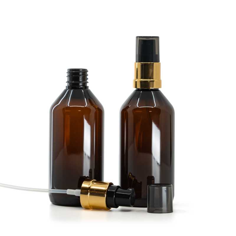 Botella de plástico marrón, dispensador negro y dorado brillante con sobretapa ahumada, 115 ml