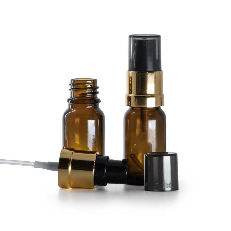Frasco de vidrio ámbar, bomba negra y dorada brillante con sobretapa ahumada, 10 ml