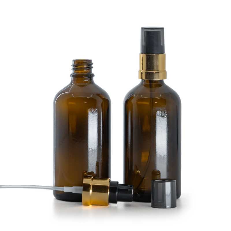 Frasco de vidrio marrón, bomba negra y dorada brillante con sobretapa ahumada, 100 ml
