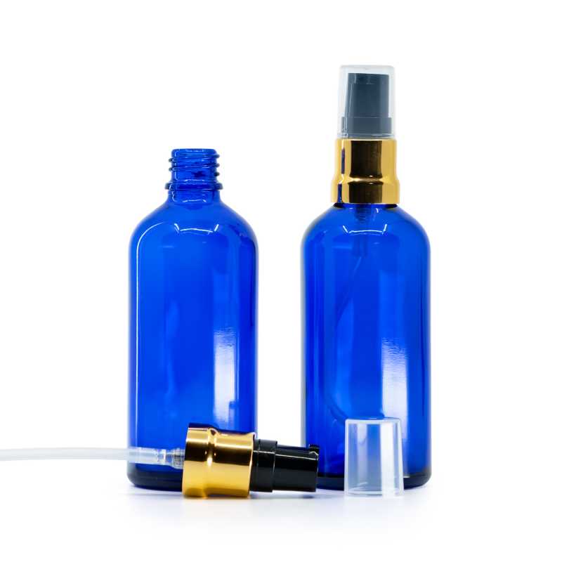 Botella de vidrio azul, dispensador negro dorado brillante con sobrecap transparente, 100 ml