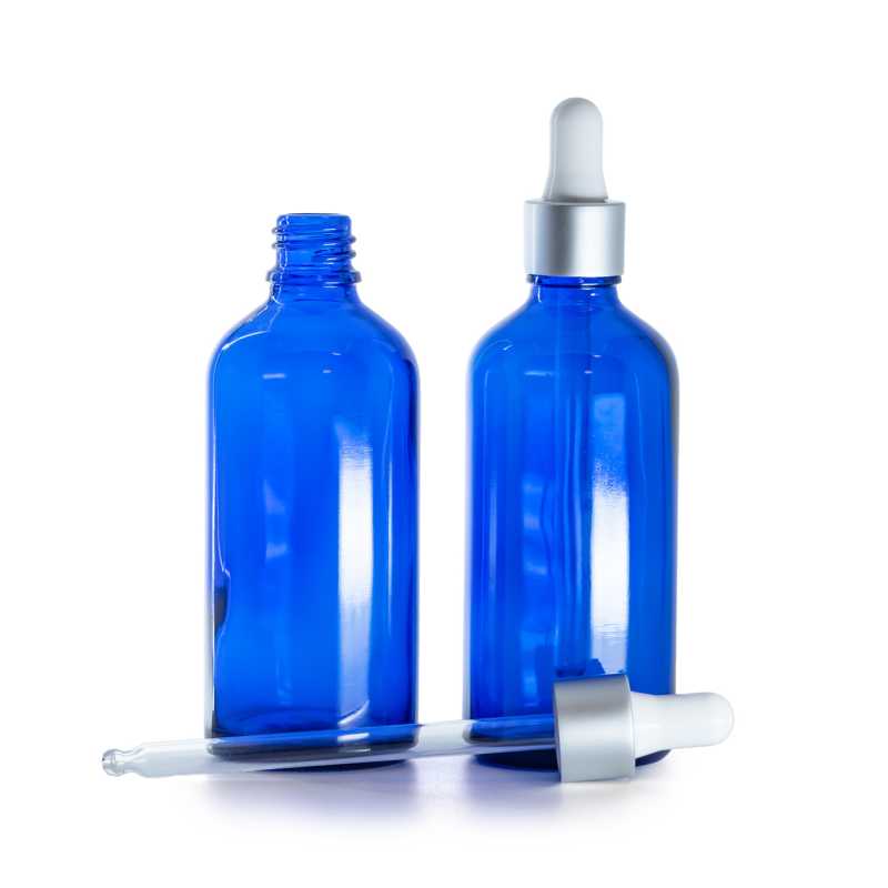 Botella de vidrio, azul, cuentagotas plateado mate, 100 ml