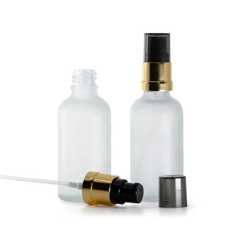 Frasco de vidrio, transparente mate, bomba negra y dorada brillante con sobretapa ahumada, 50 ml