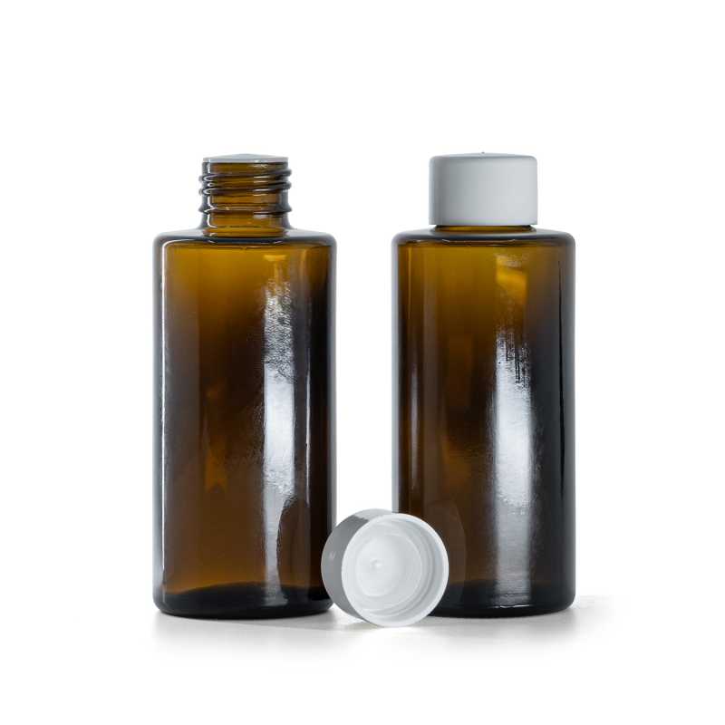 Botella de vidrio ámbar, tapón liso blanco con reductor, 100 ml