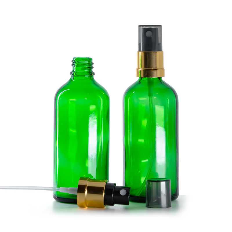 Frasco de vidrio verde, pulverizador negro y dorado, sobretapa ahumada, 100 ml